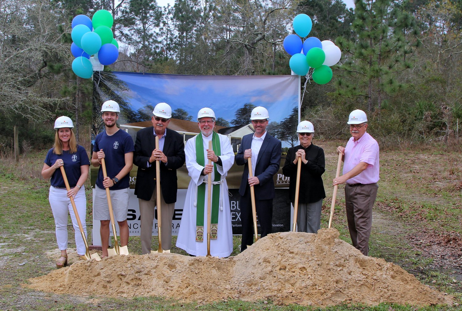 LeeAnn Anderson, Ryan Turner, Wayne Novak, Father Michael Ellis, Josh Tonge, Shirley Patterson and Ed d'Avi break ground on St. Francis in-the-Field Episcopal Church’s new Founders Youth Building on March 3.